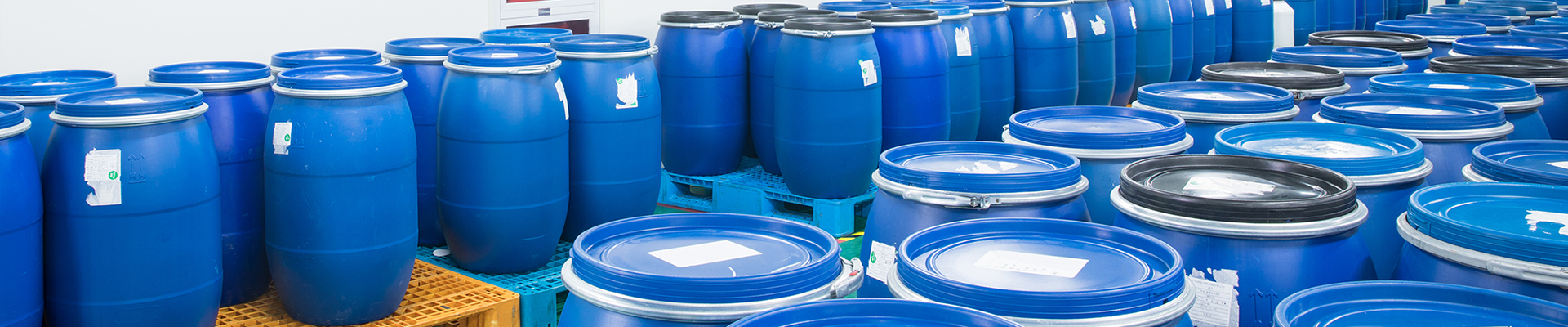 many blue bucket filled with acrylic polymer emulsion, vae emulsion etc.